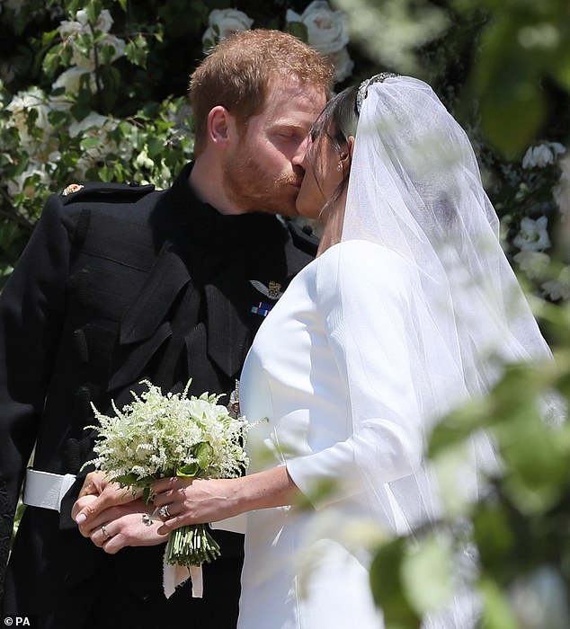 Harry and Meghan share a kiss outside St George's Chapel in Windsor. Their wedding was a picture perfect affair in the gorgeous May sunshine