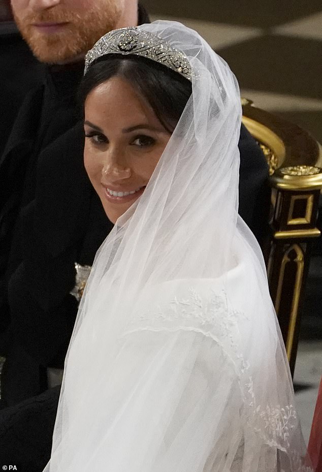 Meghan wearing Queen Mary's Diamond Bandeau Tiara on her wedding day. In 2020 it was reported that the Queen scolded Harry after he shouted at the Queen's dresser who was unable to meet Meghan's sudden demand to try on the tiara