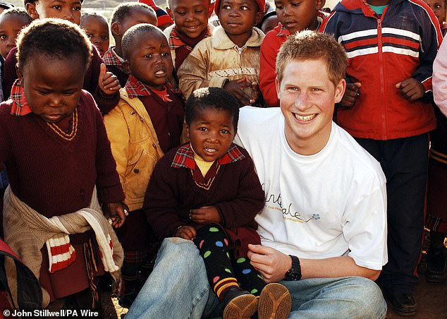 Harry with Sentebale in 2006. The charity - which helps children and teenagers tackle HIV or AIDS diagnoses - was named after the Sesotho word for 'forget-me-not' in reference to Princess Diana's favourite flower and her much praised charity work during her life