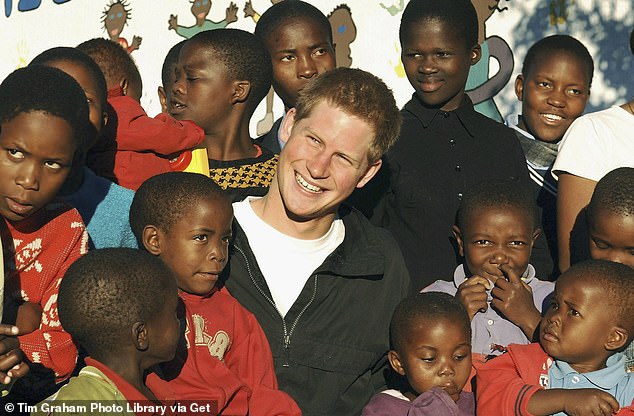 Prince Harry with children from Lesotho following the launch of his charity Sentebale in 2006. It was widely seen as the charity perhaps closest to Harry's heart