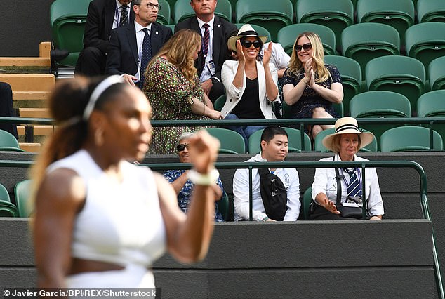 Meghan's personal assistant and a Palace Press officer sat behind her, as well as a number of security guards