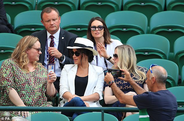 The Duchess's bodyguards warned tennis fans not to take pictures of her so she could 'engage with people rather than camera phones'