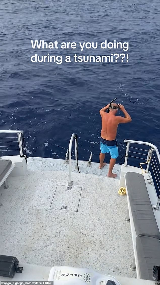 The TikToker shows a man jumping into the ocean amid the tsunami warning