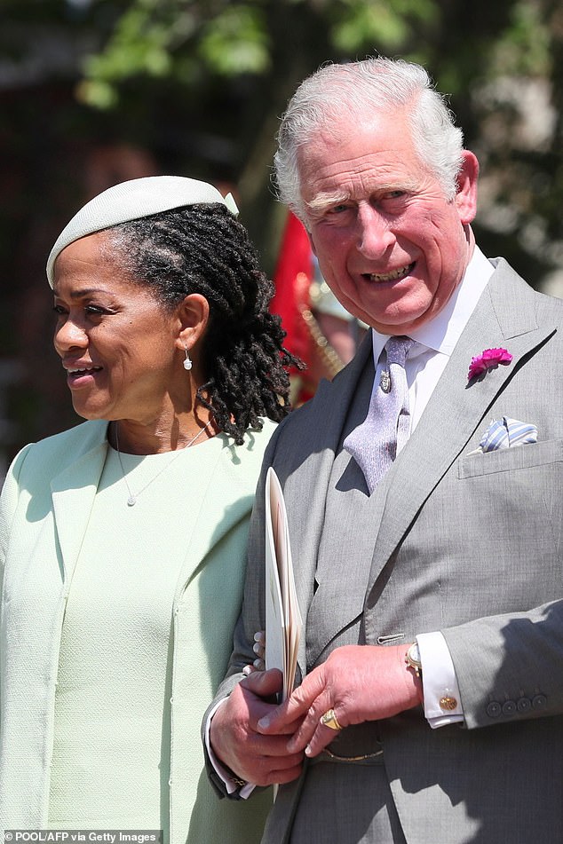 The then Prince Charles with Meghan's mother Doria Ragland. Unlike Thomas, Doria kept her head down away from the press