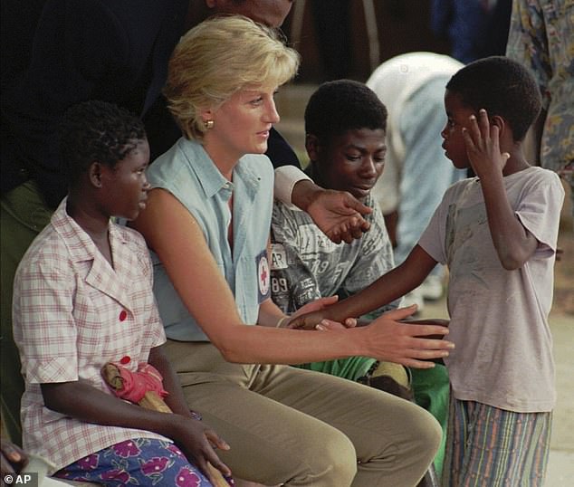The Princess of Wales with young Angolan amputees who lost their limbs due to landmines at the Neves Bendinha Orthopedic Workshop in the outskirts of Luanda