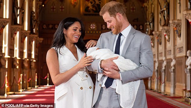 Prince Harry and Meghan pose for a photo with their newborn Archie Harrison Mountbatten-Windsor on May 8, 2019
