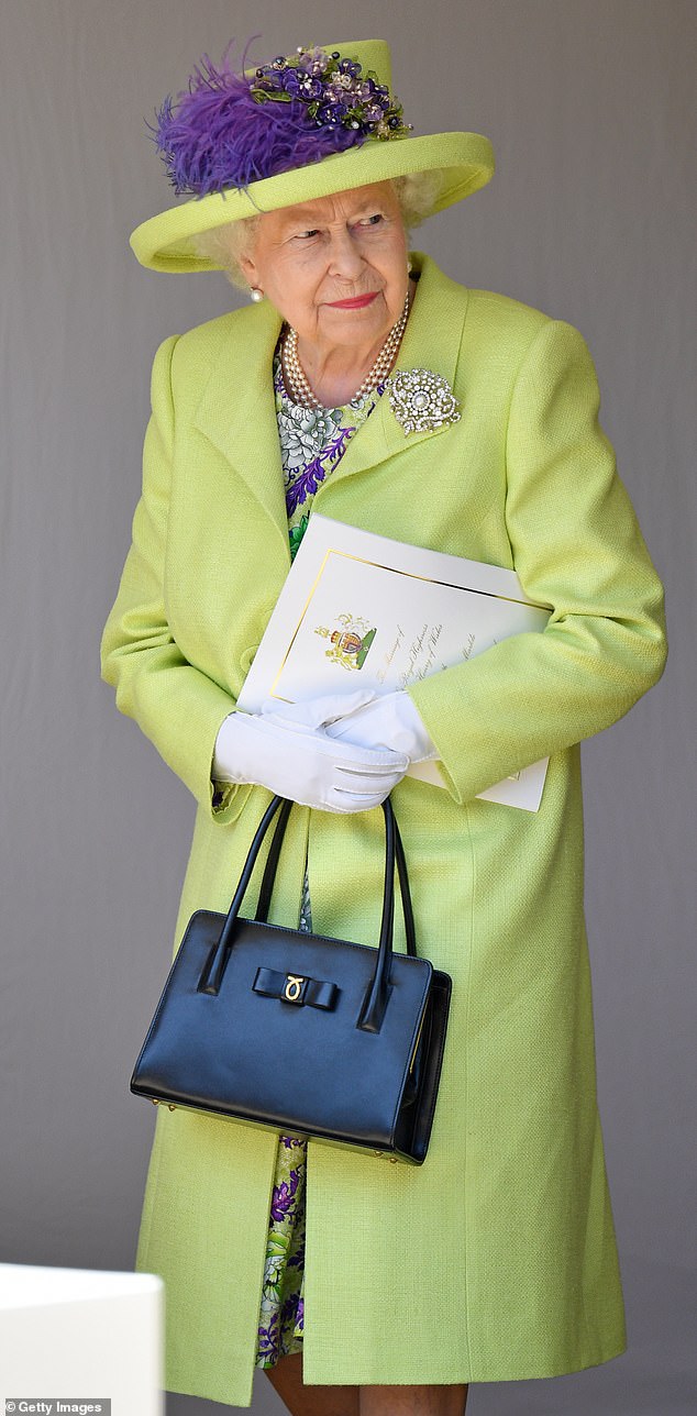The late Queen at Harry and Meghan's wedding. Harry was allegedly 'rude' to his grandmother for 10 minutes during a meeting about his wedding