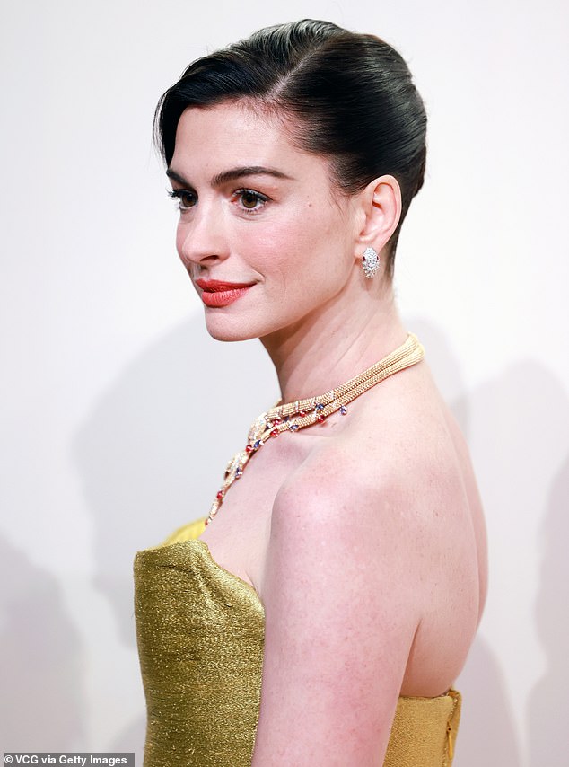 The cover saw Anne wearing a white high-neck top that boasted intricate floral embroidery as oodles of material floated around her