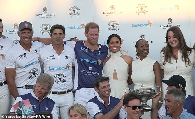 A group photo of the polo team with the Duchess of Sussex the Duke of Sussex taking centre stage