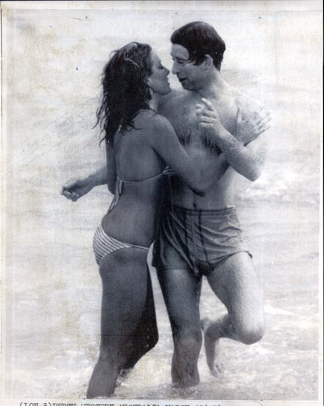 Prince Charles is approached by an admirer on a beach in Perth in 1979