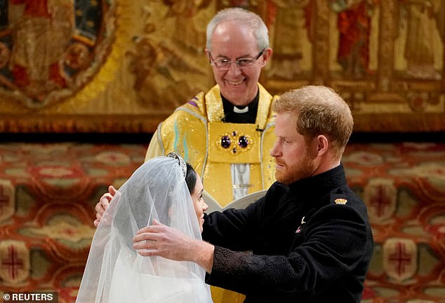 The Queen was reportedly 'dismayed' that the Sussexes were married by the Archbishop of Canterbury (centre)