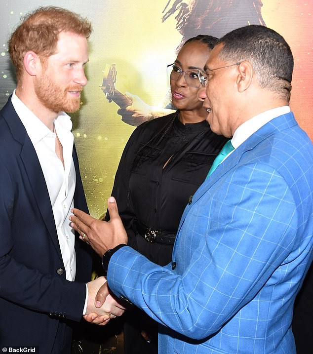 Harry chats to anti-monarchist Jamaican prime minister Andrew Holness and his wife, Juliet