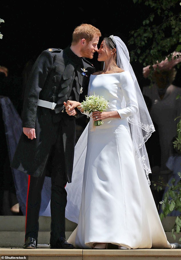 Prince Harry and Meghan Markle share a kiss outside St George's Chapel on their wedding day