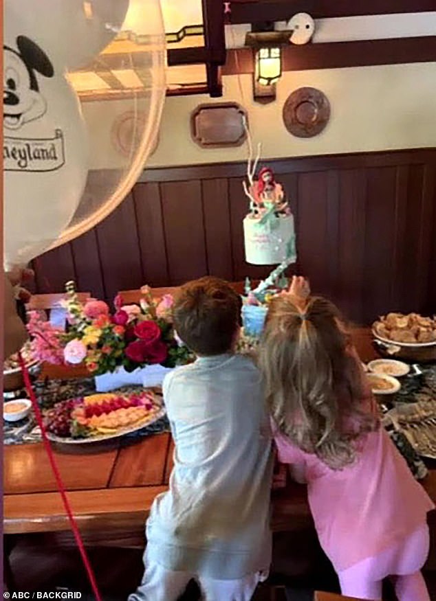 This week, Meghan shared a sweet unseen photograph of Princess Lilibet and Prince Archie (pictured together) enjoying their trip to Disneyland