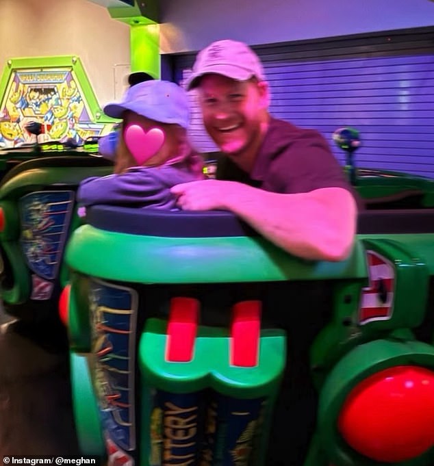 Harry flashed a cheerful smile as he turned towards the camera while sitting next to Lilibet on another ride