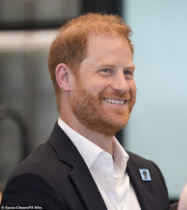 Prince Harry, pictured today at a Diana Award event, met his father for the first time in 19 months as they start to rebuild their relationship