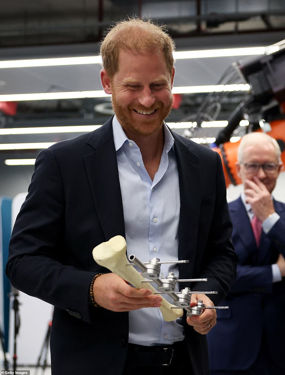 The centre said children were seven times more likely to die from blast injuries than adults and in 2023 with support from Save the Children began expanding its work to launch of the Centre for Paediatric Blast Injury Studies. Among the research Harry was shown were new designs for prosthetic knee joints for children, a demonstration of the world's most advanced foot and ankle physiological simulator, and the 'gait lab' which uses a virtual environment with motion capture cameras and a treadmill to evaluate the impact of new prosthetic designs on patients. 'Here's a good-looking man,' Harry said with a big grin when he saw Steve Arnold who was demonstrating the gait lab equipment. Like Mr Henson, Mr Arnold, who lost both his legs in an IED blast ion Afghanistan in 2011, was also well known to the Duke after taking part in the 2014 and 2017 Invictus Games as a cyclist. On Monday, Harry marked the third anniversary of Queen Elizabeth II's death by privately laying flowers at her grave in St George's Chapel, Windsor Castle.