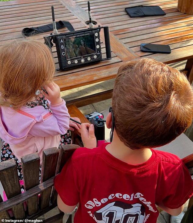 Meghan Markle put on a brave face as she shared some sweet behind-the-scenes photos from filming the second season of her 'intolerable' Netflix show - putting her daughter Lilibet, four, front and center