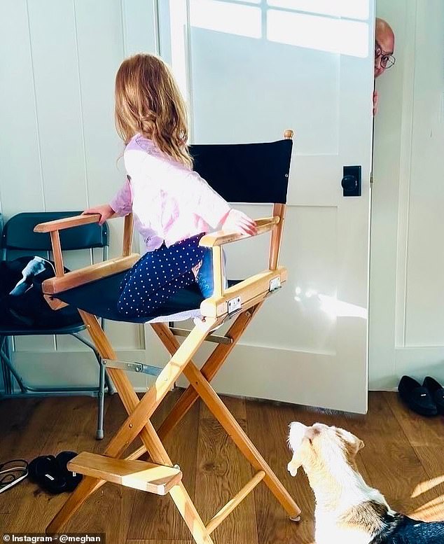 In one picture, Lilibet adorably sat in the director's chair on set, as she wore a pink jumper and navy blue polka-dot pants, her red hair on display