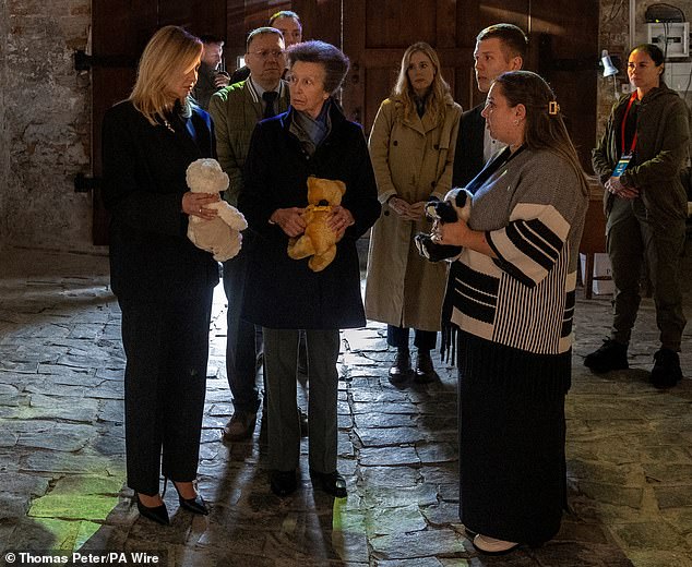 The traditional-looking teddy had a black and yellow ribbon tied in a bow around its neck. The Princess Royal is pictured with Ukraine's First Lady Olena Zelenska (left)