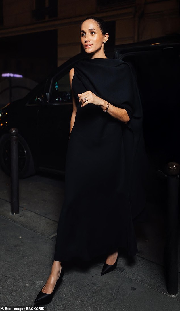 Meghan later looked elegant in all black in another Balenciaga outfit in Paris on October 4