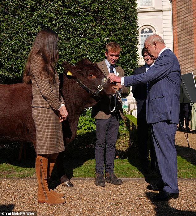Sporting some shades, the monarch, 76, grinned as he proudly stood by the farm animal at Clarence House, hosting representatives from charities and organisations that have benefited from the fund via its partnership with Waitrose Duchy Organic