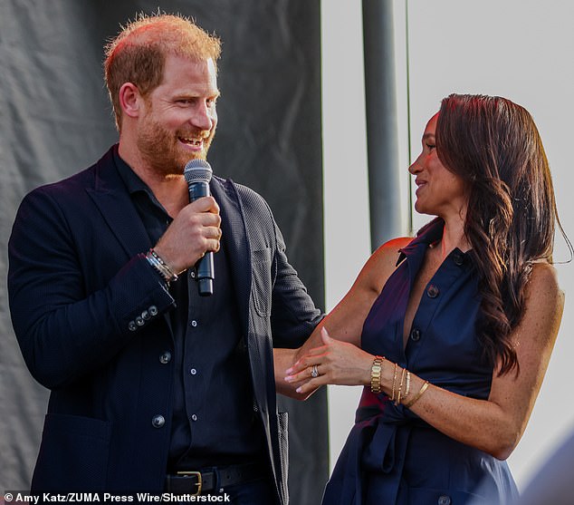 Meghan (seen with her husband Prince Harry at an event in California on September 20) wore a range of jewellery, including Princess Diana's Cartier watch and a ring thought to give a nod to royalty