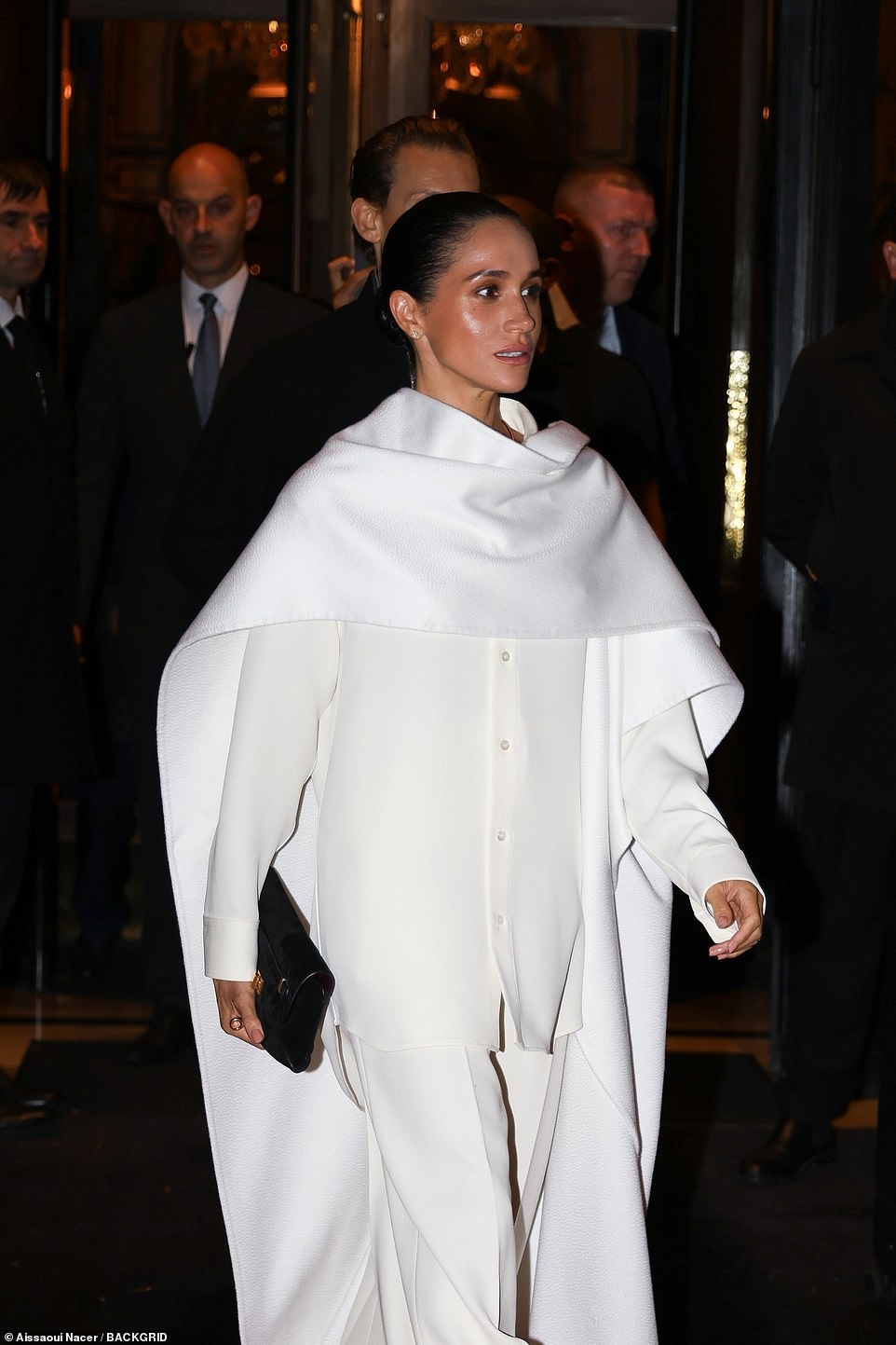 When her friend didn't seem amused, Meghan turned back around to watch the show with a more neutral expression, though a representative insisted she was not laughing at the model falling. One person speculated: 'I think it was someone tripping or falling because the girl behind her mouths "Oh!" 'Somebody probably fell,' a second said, while a third added: 'Others react to it, just not as obviously as she did.'