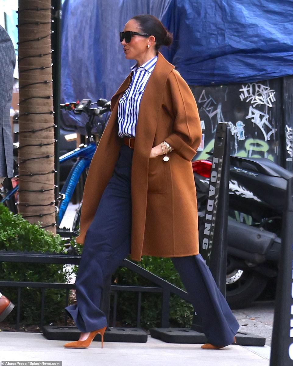 Meghan's decision to take a 10,000-mile round trip to Paris Fashion Week came straight out of the blue, Piccioli confirmed, and he helped her keep it secret. The Duchess was seen at the Spring 2026 ready-to-wear draped in a stylish white oversized cape over a white button-down shirt and matching trousers, all designed by Balenciaga, of course. She paired it with black pointed-toe heels and simple accessories, giving off a vibe of effortless elegance, topped off with a sleek, slicked-back bun.