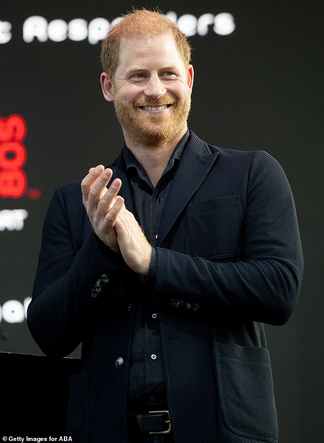 Harry was stylishly casual in a black button up which was paired with a pair of black trousers and a blazer on top
