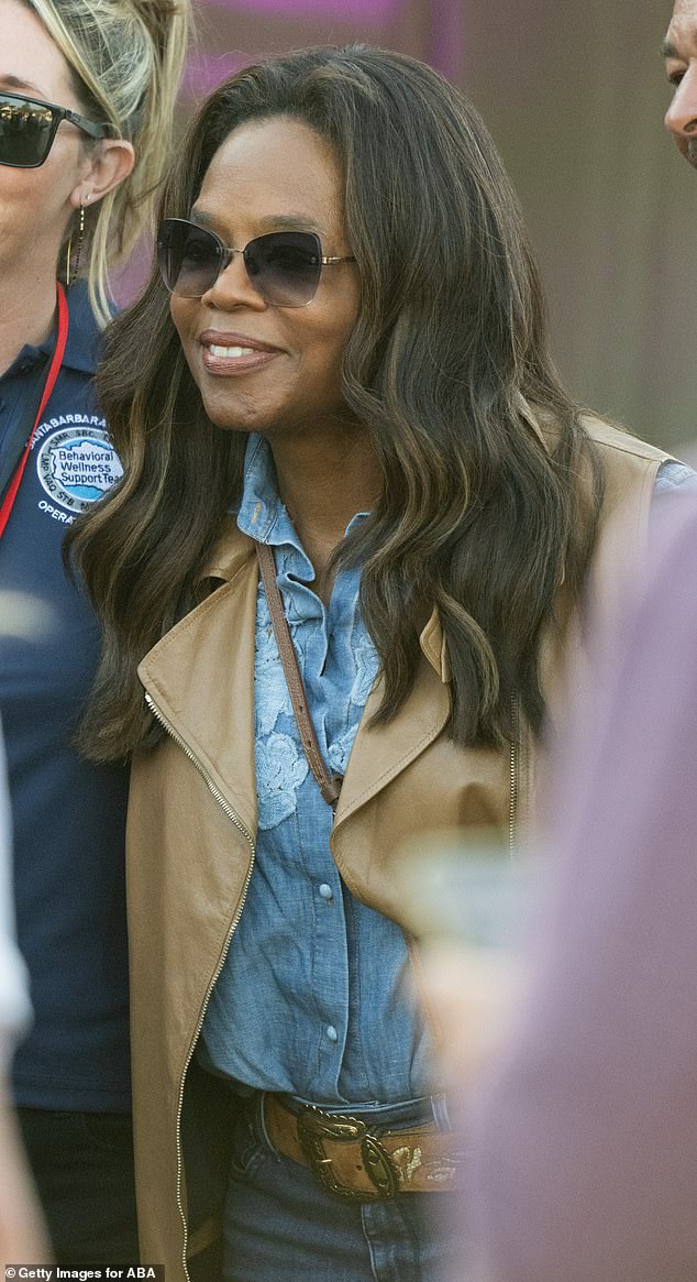 Oprah Winfrey also stopped by the event on Saturday in a fashionable ensemble - and has had a close relationship with Meghan and Harry over the years