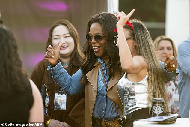 The star watched speakers and performers take to the stage while also having a blast with other guests