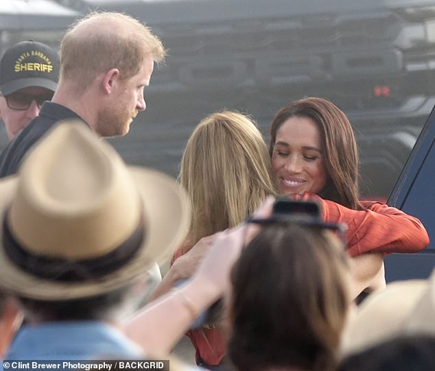Meghan and Harry took time to greet other guests as they arrived to the outdoor charity concert