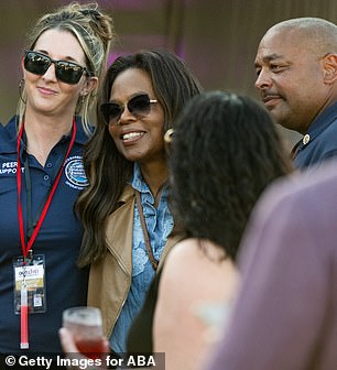 Oprah was seen also mingling with attendees and paused to take photos with first responders