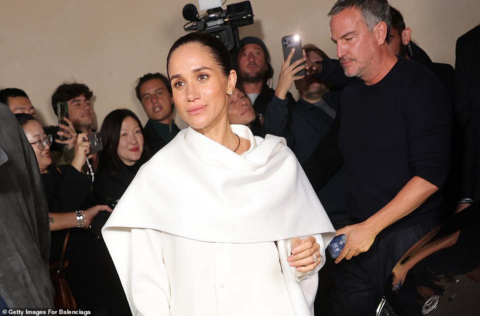 Other commenters ridiculed 'self-obsessed' Meghan for appearing to make the show all about her. 'Meghan, you're not a model, they're simply just walking you to your seat! Meghan walking with her cape like she's the second coming of the Messiah,' one wrote. However, others complimented the Duchess and said: 'Love that energy. Channel your inner princess,' and another said: 'She is so elegant and has always had style.'