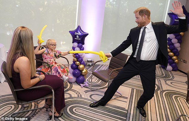 It is understood that senior Met officers 'acted on their own initiative' to offer him protection while he was in the capital for the WellChild Awards (pictured: Harry having a balloon sword fight with nine-year-old Gwen Foster, recipient of Inspirational Child 7-11 award, at the annual WellChild Awards 2025)