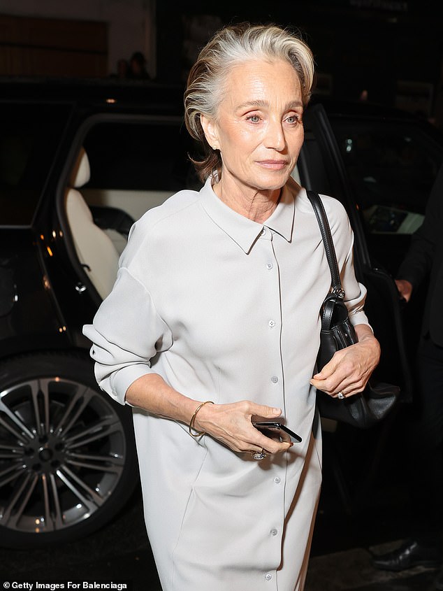 Dame Kristin Scott Thomas showed off her slender frame in a white floor-length dress that was buttoned from the top down