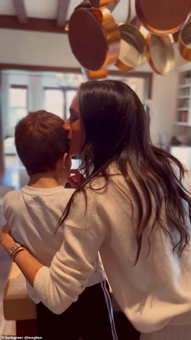 Meghan and Harry 'fell in love' with the Masaka kids after watching videos with Prince Archie. Meghan and Archie are pictured making cookies in a home video