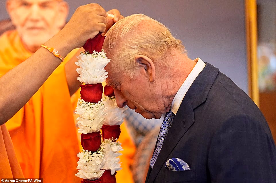 Stretching to 102,018 square feet, the temple was built using classical Vedic architectural principles, meaning it has no structural steel. The King wore a suit and blue tie, the Queen a dark green jacket and skirt. Both removed their shoes after entering. On arrival, they were greeted by Sadhu Yog Vivek Swami, who held his hands together and bowed in greeting, a gesture the King returned. The temple leaders then presented both with flower garlands - of roses, carnations and foliage with a string of pearl beads - and nada-chadi - a sacred thread tied around their wrists.