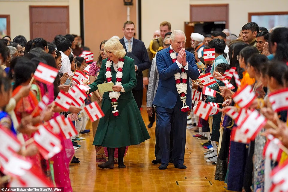 On the conversation with the King, Mr Patel said, 'It was proper out of the blue. 'He was asking us about Diwali and how the celebrations were and he was even joking around with the kids as well.' Aasha said she had the 'giggles' before the meeting but looked forward to telling her classmates 'I met the King and Queen' when she returned after half term. Hinal added she had queued after the late Queen's death in 2022 and previously met Charles at Diamond Jubilee celebrations. It's been a tricky a week for the King who was heckled by protester on Monday. The heckler's identity remains unknown but a video of the outburst shows him being pulled back by a frustrated onlooker as he launched the tirade.