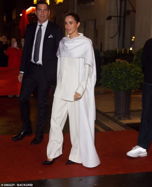 The Duchess of Sussex was all smiles as she was seen leaving her hotel on her way to the Balenciaga show in the French capital
