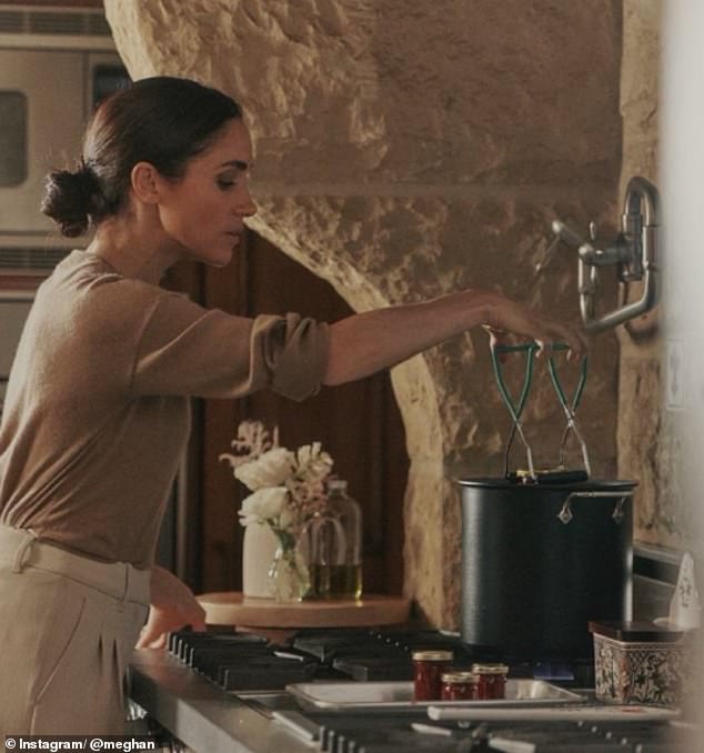 Meghan Markle has left royal fans baffled after they noticed that she appeared to be holding her jam equipment upside down in new photographs