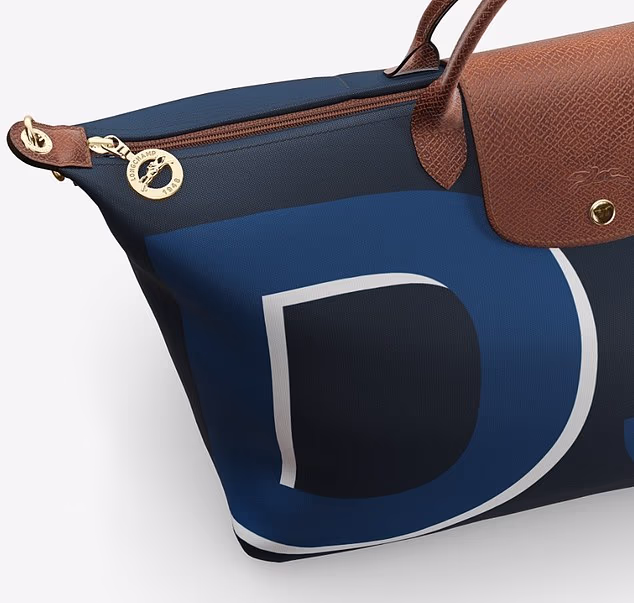In footage shared on Instagram, eagle-eyed fans quickly spotted Meghan's new Longchamp Travel Bag, emblazoned with 'DS' - a nod to her royal title, the Duchess of Sussex