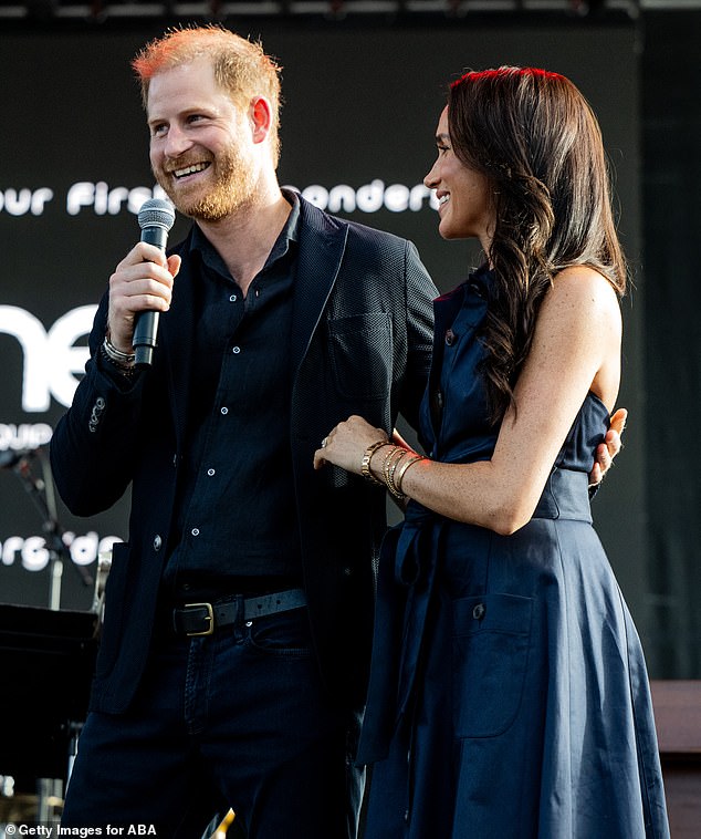 The mother-of-two elevated the glamour of her sophisticated navy dress with diamonds, gold Cartier jewellery and her weighty engagement ring