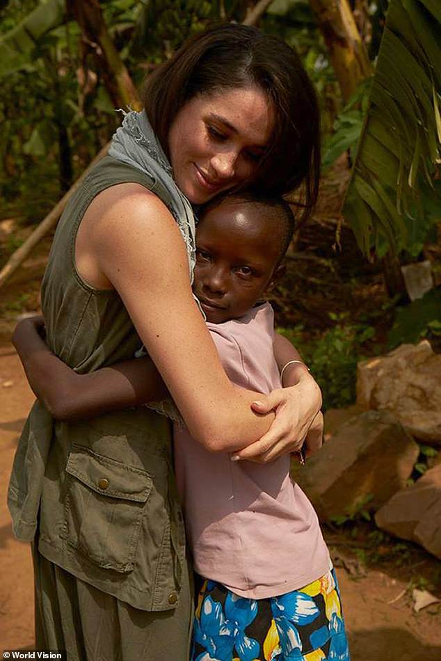 A photo issued by World Vision of Meghan hugging a child during a visit to Rwanda in 2016