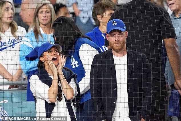 Prince Harry (right) and Meghan Markle (left) watch in the seventh inning between the Toronto Blue Jays and the Los Angeles Dodgers during game four of the 2025 MLB World Series at Dodger Stadium