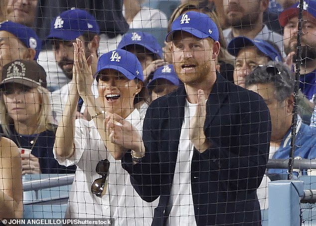 Prince Harry and Meghan Markle attend the fourth game of the MLB World Series between the Los Angeles Dodgers and the Toronto Blue Jays