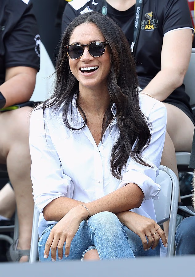 When Meghan Markle made her first public appearance with Prince Harry at the Invictus Games in Toronto back in 2017 she paired her white button-down Micha Nonoo Husband shirt with a pair of ripped Mother Denim jeans