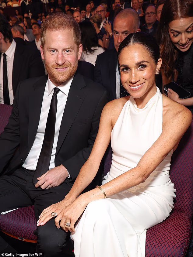 Meghan wore a custom Oscar de la Renta halterneck evening gown with exposed back. The look was reminiscent of one of her most iconic outfits - the Stella McCartney reception dress from her 2018 wedding