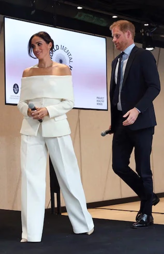 Markle looked chic in a white off-the-shoulder blazer and trousers as she attended a World Mental Health Day event in New York in 2023. The Altuzarra jacket featured a wide folded-down neckline and was paired with wide-leg trousers